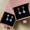 Starburst stud dangles grey